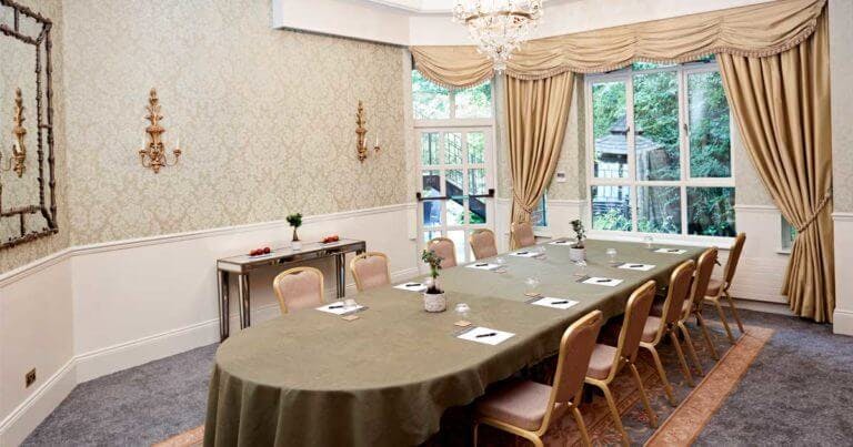 Room set up for a conference with large table