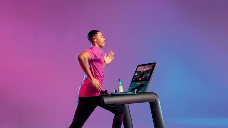 Man working out using Technogym equipment