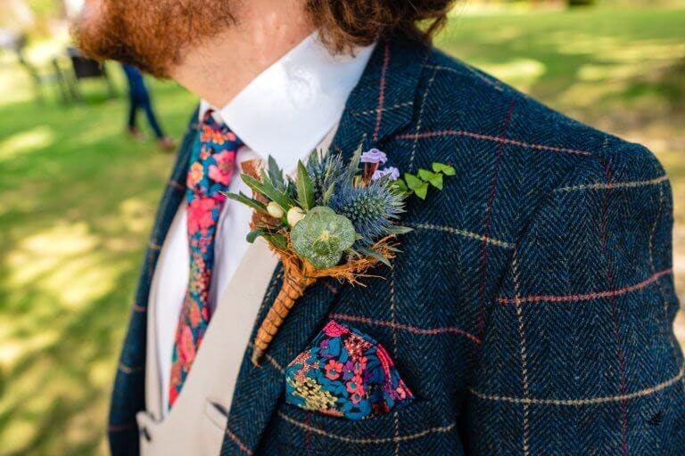 Close up of the Groom across his shoulder