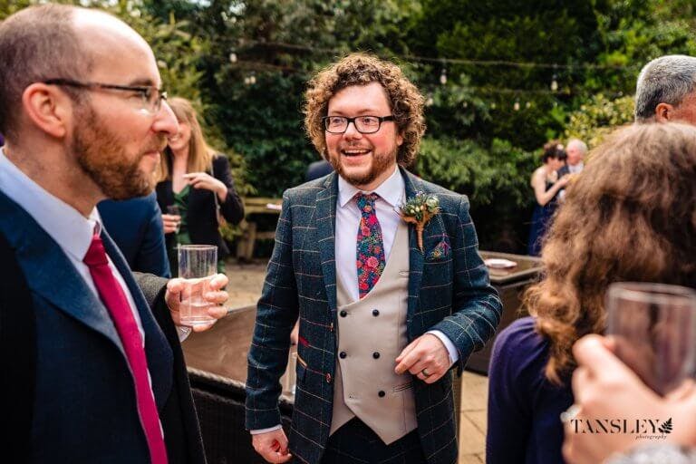 The Groom chats with guests during the drinks reception
