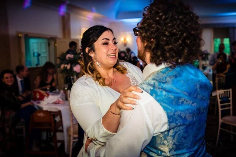 Bride & Groom smile during their first dance