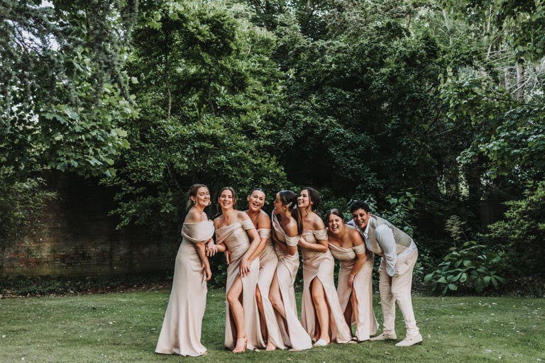 Bridesmaids pose for photos