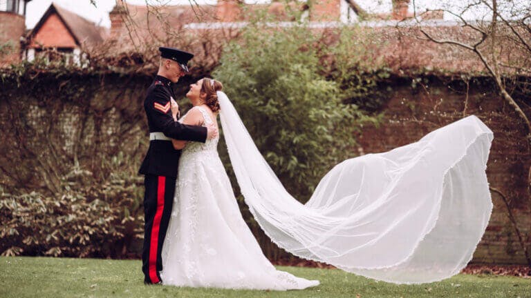 Bride & Groom pose in the garden