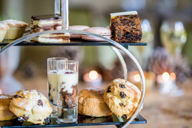 Christmas themed afternoon tea cakes on a cake stand