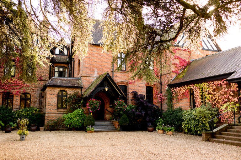 Careys Manor hotel main entrance on colourful autumn day