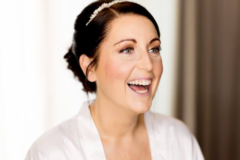 Happy bride on wedding day at Careys Manor hotel