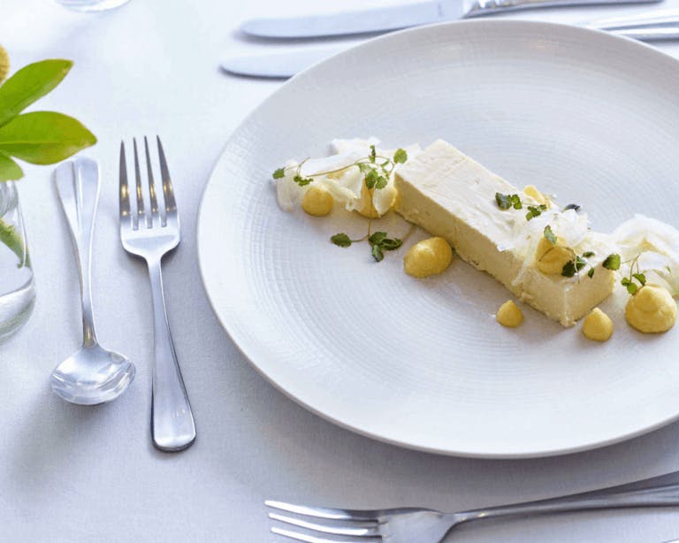 Wedding food dish laid out on table at wedding breakfast