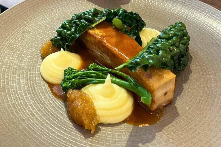 Main served at New Forest restaurant Cambium. Braised pork belly, buttermilk mash potato, turnip marmalade, cavolo nero, cider sauce £24.95