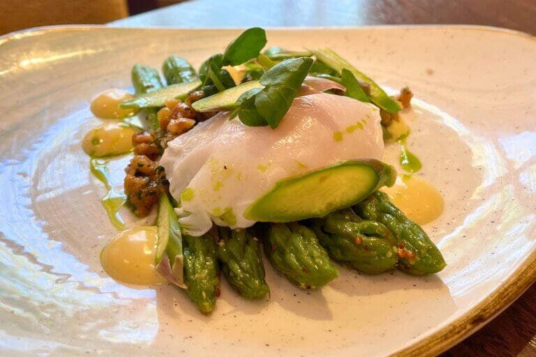 Starter at New Forest restaurant Cambium. New Forest asparagus, truffle emulsion, poached duck egg, hazelnut pesto £12.50