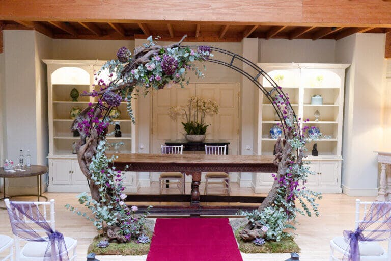 The moon gate with purple flowers and foliage