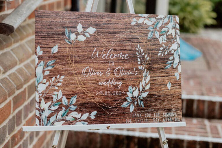 Oliver & Olivia Welcome sign for their wedding on a rustic wooden board