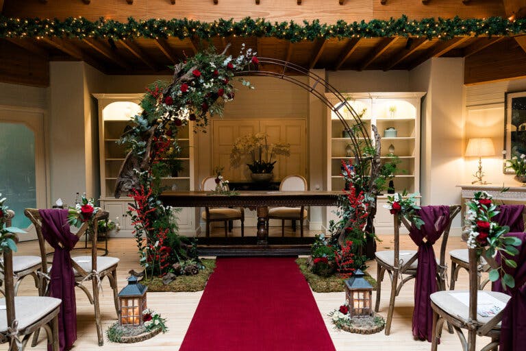 Close up of the registrars table with the moon gate behind it for Maxine and Alastair's wedding at Hampshire wedding venue Careys Manor Hotel & SenSpa.