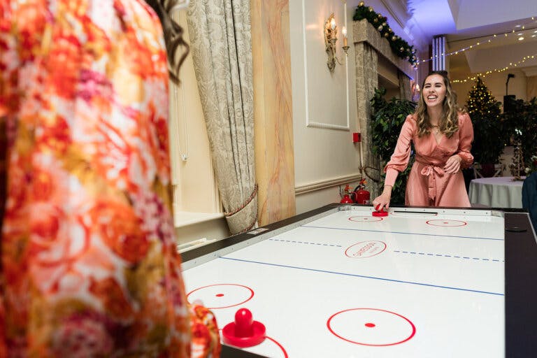 Maxine & Alastair's wedding reception. Reception laugh and play shuffle board.