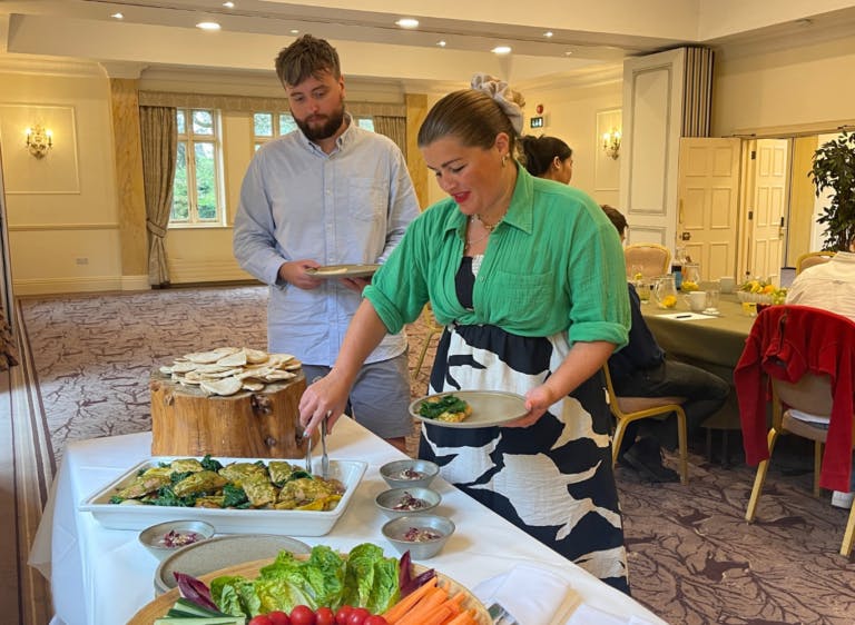 Guests help themselves to a healthy lunch as part of Hampshire conference venue Careys Manor hotel's corporate wellbeing package on a team away day.