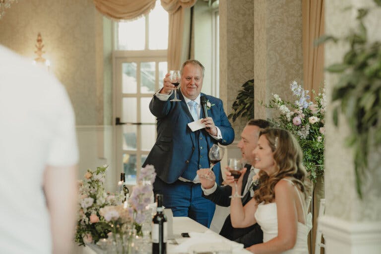Father of the bride raises a glass to couple
