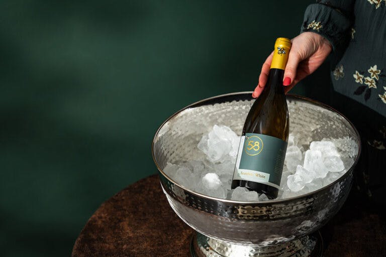 Bottle of B58 Beaulieu white wine on ice