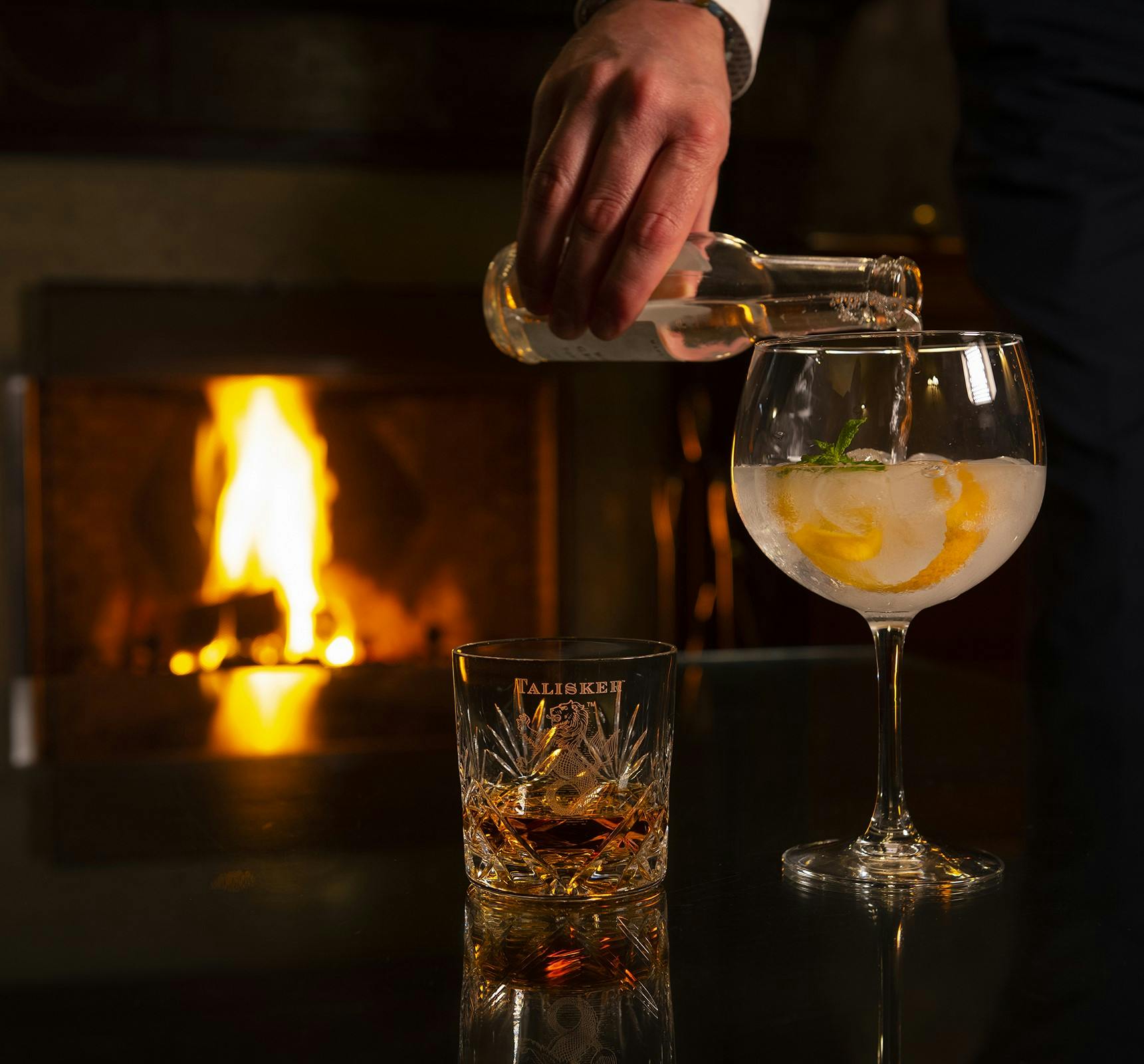 Fireside whisky pouring at Duisdale House Hotel