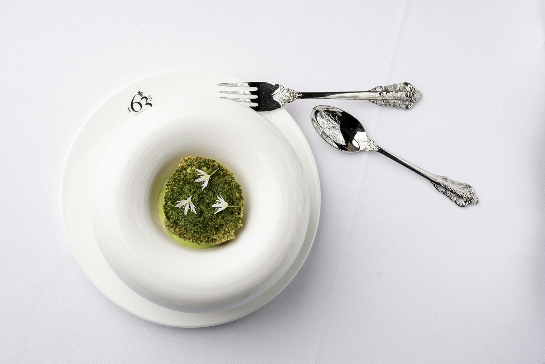 Picture of a starter served in the 1635 restaurant - served in a branded bowl with silver cutlery