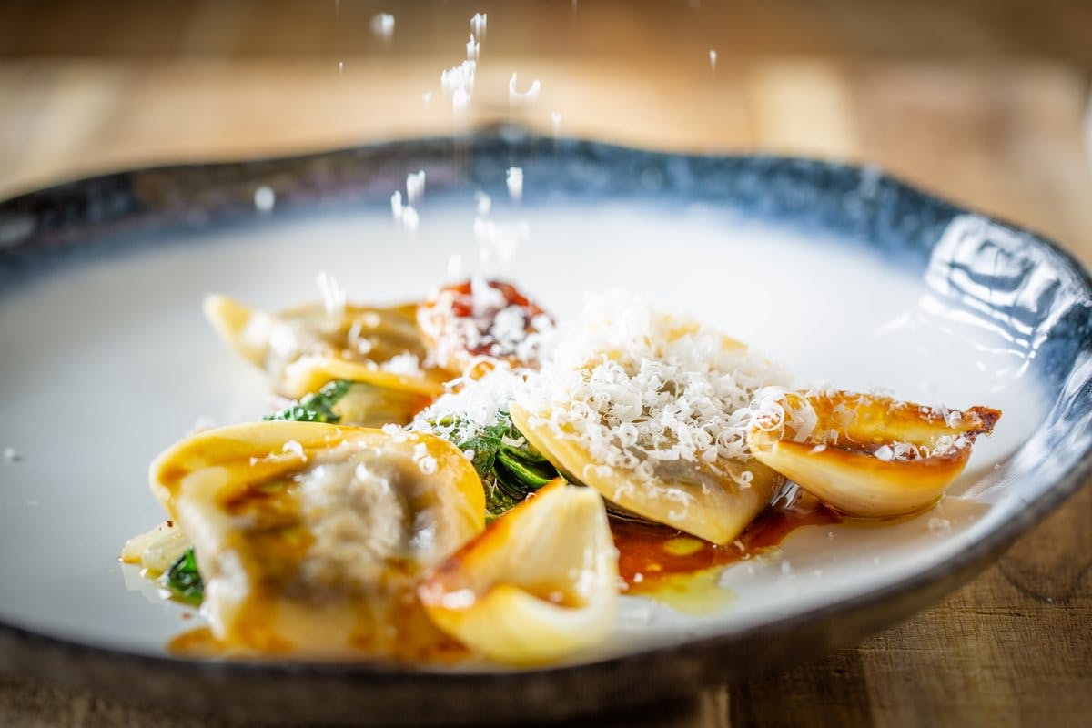 Sauce at The Painswick dining room with panoramic valley windows and beautifully plated seasonal dishes