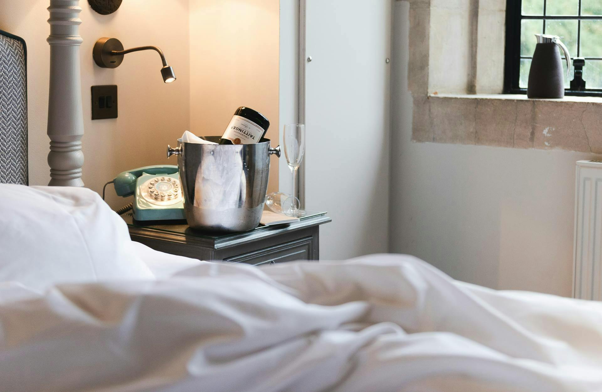 Cosy room in Garden Wing with plush king bed, country-chic wallpaper, and ambient bedside lighting