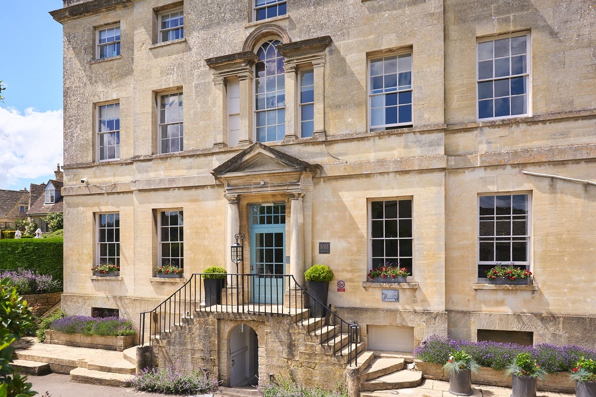 Italianate Garden Terrace and manicured lawns during outdoor cocktail hour overlooking hills